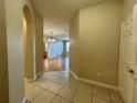 Tiled entryway leading to living areas at 6466 Cava Alta Dr # 404, Orlando, FL 32835