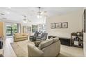 Spacious living room with ample seating and tile floors at 1381 Hazeldene Mnr, Deland, FL 32724