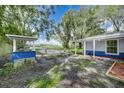 Backyard with grilling station and open space at 313 Story Partin Rd, Orlando, FL 32833