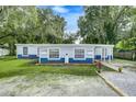 Charming blue house with landscaping and yard at 313 Story Partin Rd, Orlando, FL 32833