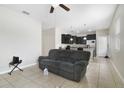 Living room with a recliner and view of the kitchen at 1209 Seburn Rd, Apopka, FL 32703