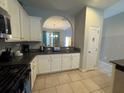 Modern kitchen with granite countertops and breakfast bar at 5294 Wildwood Way, Davenport, FL 33837