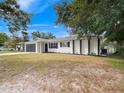 Charming ranch home featuring a newly painted exterior and landscaping at 5400 Fox Briar Trl, Orlando, FL 32808