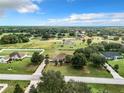 Aerial view showcasing the house and surrounding area at 24341 Milford Dr, Eustis, FL 32736