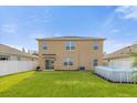 Two-story house with a backyard, above ground pool, and fence at 1139 August Sky Dr, Deltona, FL 32738