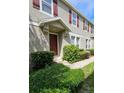 Townhome's front entrance with landscaping and walkway at 10759 Gran Paradiso Dr # S, Orlando, FL 32832