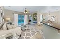 Bright living room features fireplace, pool view, and comfortable seating at 8038 Glitter Ct, Orlando, FL 32836