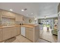 Fully equipped kitchen with light wood cabinets and tile floors at 4831 Saxon Dr # 2270, New Smyrna Beach, FL 32169