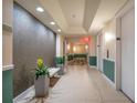 Building hallway with tile floors, plants, and neutral colors at 322 E Central Blvd # 1214, Orlando, FL 32801