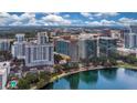 Aerial view of a high-rise building near a lake in the city at 322 E Central Blvd # 1214, Orlando, FL 32801