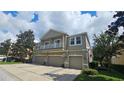 Tan three-story townhome with double garage and balconies at 10759 Gran Paradiso Dr # S, Orlando, FL 32832