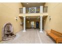 Building entryway with fountain, elevator, and seating at 11434 Jasper Kay Ter # 306, Windermere, FL 34786