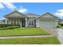 House exterior with landscaping and driveway at 8038 Glitter Ct, Orlando, FL 32836