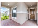 Inviting front entry with brick pavers and a light brown door at 2717 Greenlands St, St Cloud, FL 34772