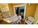 Balcony with table and chairs, great for outdoor dining at 8101 Resort Village Dr, Orlando, FL 32821