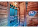 Themed nautical bathroom with a jail cell door at 8988 Stinger Dr, Champions Gate, FL 33896