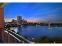 Stunning nighttime lake view with city skyline and fountain at 322 E Central Blvd # 901, Orlando, FL 32801