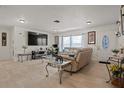 Spacious living room featuring a large TV and comfortable seating at 1421 Avenue G Ne, Winter Haven, FL 33881