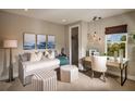 Cozy bedroom with daybed, desk, and ample natural light at 2944 Scout Street, Saint Cloud, FL 34771