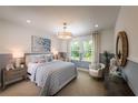 Bright bedroom with a queen bed and sitting area at 2944 Scout Street, Saint Cloud, FL 34771