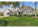 Two-story house with double garage and manicured lawn at 372 Hinsdale Dr, Debary, FL 32713