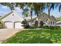 Two-story house with double garage and manicured lawn at 372 Hinsdale Dr, Debary, FL 32713