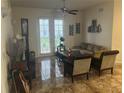 Living room with tiled floors and French doors at 3000 Laurel Park Ln # 104, Kissimmee, FL 34741