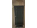 Dark-green front door with a welcome mat at 3000 Laurel Park Ln # 104, Kissimmee, FL 34741