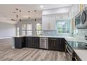 Modern kitchen featuring sleek cabinetry and a large island at 2228 Sylvan Ct, Kissimmee, FL 34746