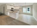 Bright kitchen boasts an island, granite countertops, and ample cabinet space at 4197 Sagefield Dr, Harmony, FL 34773