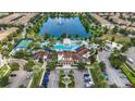 Community pool, clubhouse and lake at 8869 Rhodes St, Kissimmee, FL 34747