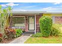 House entrance with brick facade and landscaping at 4092 Gay Nell Ct, Orlando, FL 32811