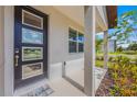 Inviting front porch with modern door and landscaping at 11777 Globe St, Orlando, FL 32832