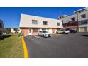 Condo building exterior with parking spaces at 3750 S Atlantic Ave # 230, Daytona Beach, FL 32118