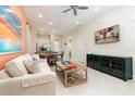 Living room with open concept floor plan and adjacent dining area at 3074 Key Lime Loop, Kissimmee, FL 34747