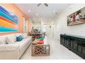 Living room with open concept floor plan and adjacent dining area at 3074 Key Lime Loop, Kissimmee, FL 34747