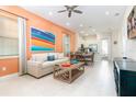 Open living area with comfortable sofa, coffee table, and dining area at 3074 Key Lime Loop, Kissimmee, FL 34747