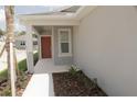 New construction home with front porch and landscaping at 3538 Treetop St, Deland, FL 32724