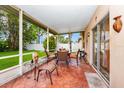 Cozy screened porch with patio furniture at 250 White Marsh Cir, Orlando, FL 32824