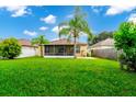 Large backyard with screened porch at 250 White Marsh Cir, Orlando, FL 32824