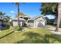 Two-story house with a gray exterior and landscaping at 2401 Piedmont Lakes Blvd, Apopka, FL 32703