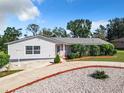 Newly renovated home with a landscaped yard at 2281 E Union Cir, Deltona, FL 32725