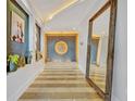 Elegant entryway with large mirror and artwork at 1 S Eola # 23, Orlando, FL 32801