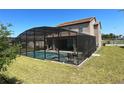 Screened pool and spa with patio furniture in backyard at 226 Macaulays Cv, Haines City, FL 33844