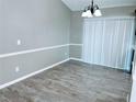 Simple dining room with tile floors and sliding glass door at 2870 Chalmer St, Deltona, FL 32738