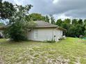 Spacious backyard with grassy area and seating at 1501 Fort Smith Blvd, Deltona, FL 32725