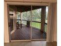 Screened balcony overlooking a wooded area at 470 S Pin Oak Pl # 204, Longwood, FL 32779