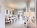 Elegant dining room with a white table and chairs at 1800 Kindle St, Kissimmee, FL 34744