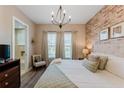 Spacious main bedroom with ensuite bath and brick wall at 2602 Sunrise Shores Dr, Kissimmee, FL 34747