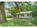 One story house with carport and green door at 104 E Mcclendon St, Lady Lake, FL 32159